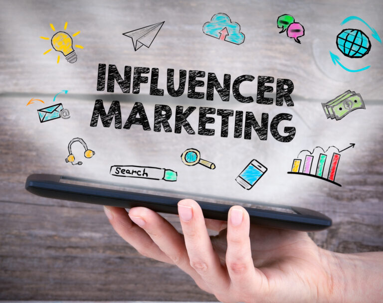 Photo of a phone with the words influencer marketing.