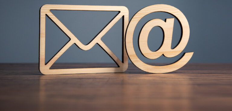 SMS and Email symbols on a table waiting to be seen.
