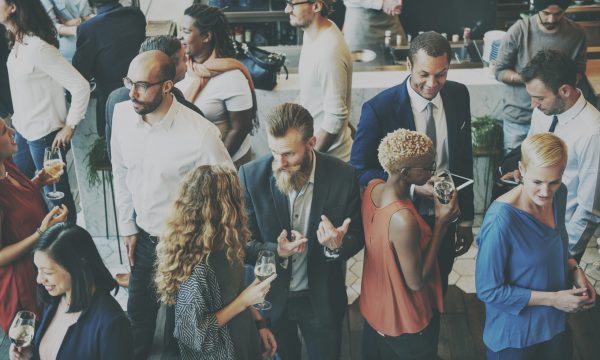 A social gathering, with business professionals looking to advance their network.